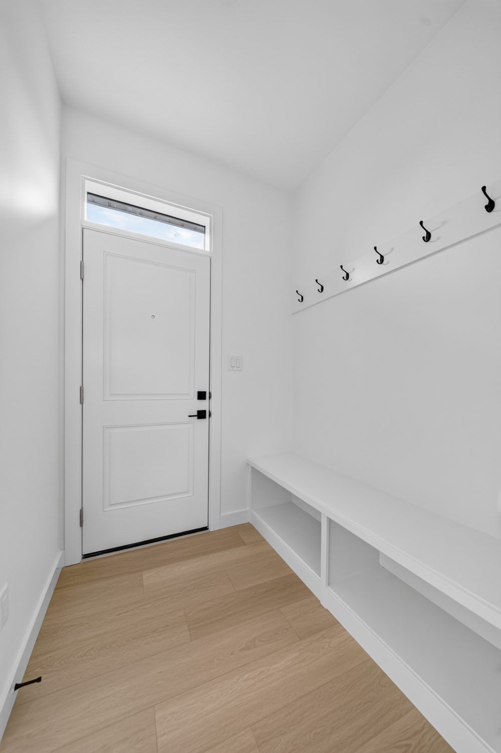 Rear mudroom with bench and hooks